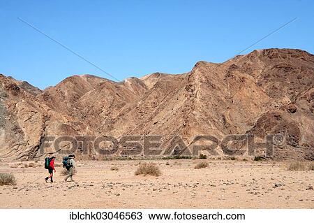 Stock Image - "Hiking in the Fish River Canyon, Fish River Canyon, Namibia, Africa". Fotosearch