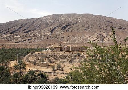 "Hill with deep cuts from erosion, settlement, date palms, Sur, Ash Sharqiyah province, Sultanate of Oman, Arabian Peninsula" View Large Photo Image Stock Photo - "Hill with deep cuts from erosion, settlement, date palms, Sur, Ash Sharqiyah province, Sultanate of Oman, Arabian Peninsula". Fotosearch