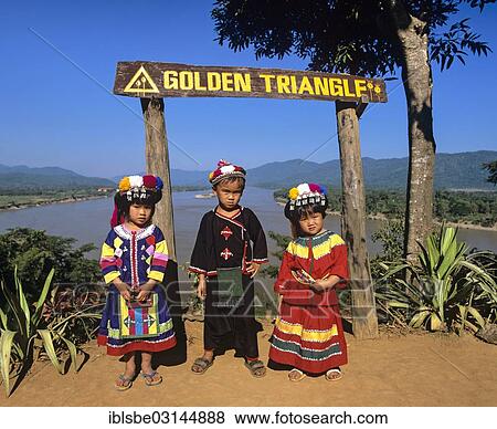 "Hilltribe children before sign """"Golden Triangle"""", border triangle of Myanmar, Thailand and Laos, Amphoe Chiang Saen, Chiang Rai Province, Thailand, Asia" View Large Photo Image Stock Photo - "Hilltribe children before sign """"Golden Triangle"""", border triangle of Myanmar, Thailand and Laos, Amphoe Chiang Saen, Chiang Rai Province, Thailand, Asia". Fotosearch