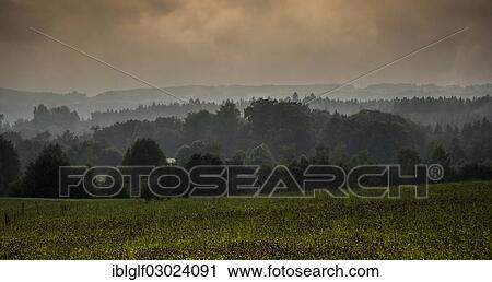 "Hilly landscape with a forest and meadows, mist, Ergertshausen, Egling, Bavaria, Germany, Europe" View Large Photo Image Stock Image - "Hilly landscape with a forest and meadows, mist, Ergertshausen, Egling, Bavaria, Germany, Europe". Fotosearch