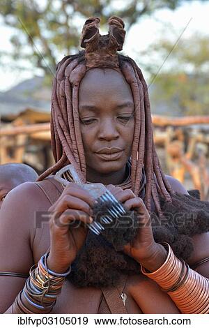 "Himba woman combing her hair, Omuramba, Kaokoland, Kunene, Namibia, Africa" View Large Photo Image Stock Photo - "Himba woman combing her hair, Omuramba, Kaokoland, Kunene, Namibia, Africa". Fotosearch