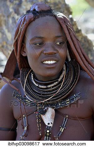 Stock Photo - "Himba woman with typical hair style, Ovikange, Kaokoland, Kunene, Namibia, Africa". Fotosearch