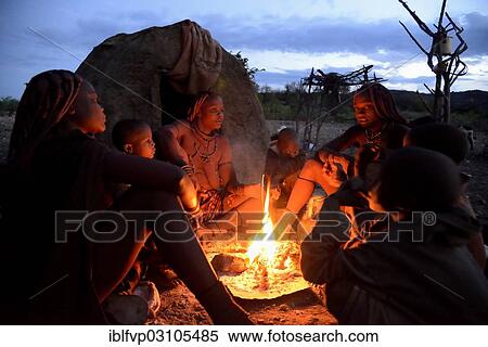 "Himba women sitting around a fire in the early morning, Ombombo, Kaokoland, Kunene, Namibia, Africa" View Large Photo Image Stock Photography - "Himba women sitting around a fire in the early morning, Ombombo, Kaokoland, Kunene, Namibia, Africa". Fotosearch