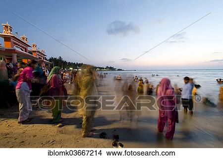 "Hindu pilgrims taking a holy bath in the sea before sunrise, at the Ghat Agni Theertham, Rameswaram, Pamban Island, Tamil Nadu, India, Asia" View Large Photo Image Picture - "Hindu pilgrims taking a holy bath in the sea before sunrise, at the Ghat Agni Theertham, Rameswaram, Pamban Island, Tamil Nadu, India, Asia". Fotosearch