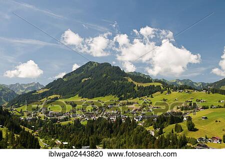 Stock Image - "Hirschegg in Kleinwalsertal Valley, Mt Heuberg, 1795m, at back, Vorarlberg, Austria, Europe". Fotosearch