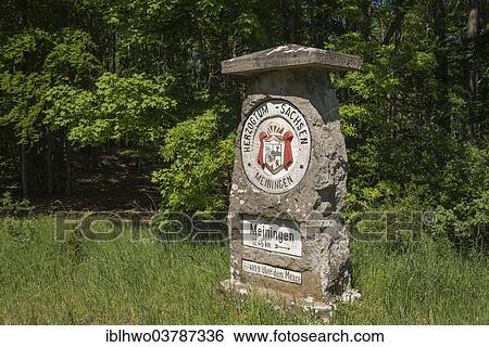 Stock Photograph - "Historic boundary stone with crest of the Duchy of Saxe-Meiningen, now border of Thuringia and Bavaria, Henneberg, Thuringia, Germany, Europe". Fotosearch