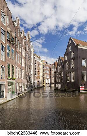 "Historic buildings along the Oudezijds Achterburgwal canal in Amsterdam, Holland, Netherlands, Europe" View Large Photo Image Stock Photograph - "Historic buildings along the Oudezijds Achterburgwal canal in Amsterdam, Holland, Netherlands, Europe". Fotosearch