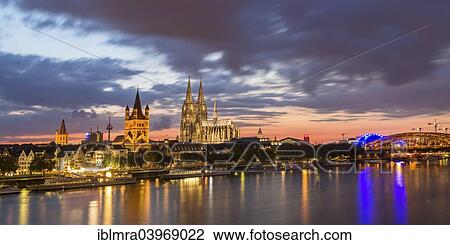 "Historic centre with Cathedral, Great St. Martin Church, Colonius, WDR building, City Hall, and Hohenzollern Bridge, the Rhine at the front, dusk, Cologne, North Rhine-Westphalia, Germany, Europe" View Large Photo Image Stock Image - "Historic centre with Cathedral, Great St. Martin Church, Colonius, WDR building, City Hall, and Hohenzollern Bridge, the Rhine at the front, dusk, Cologne, North Rhine-Westphalia, Germany, Europe". Fotosearch
