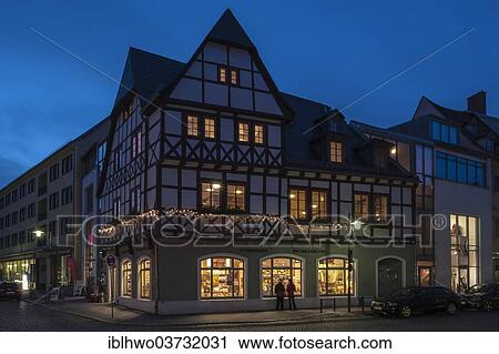 Stock Image - "Historic fire house, half-timbered house, today a bookshop, night scene, Weimar, Thuringia, Germany, Europe". Fotosearch