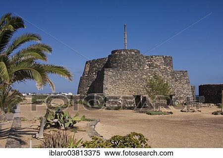 "Historic fortress complex on the beach promenade of Caleta de Fuste, Fuerteventura, Canary Islands, Spain, Europe" View Large Photo Image Stock Photography - "Historic fortress complex on the beach promenade of Caleta de Fuste, Fuerteventura, Canary Islands, Spain, Europe". Fotosearch