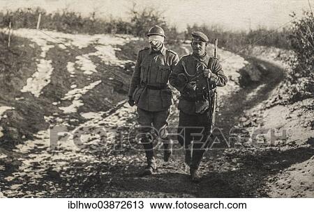 Stock Image - "Historic photograph, Romanian soldier being led blindfolded by a German soldier as a negotiator through the front line, World War I, Romania, Europe". Fotosearch