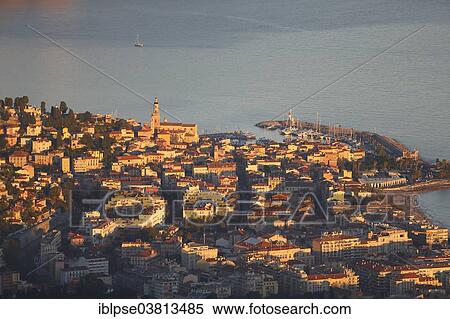 "Historic town centre and port of Menton in the evening light, seen from Mont Gros, Roquebrune Cap Martin, Alpes-Maritimes, Provence-Alpes-Cote d'Azur, France, Europe" View Large Photo Image Stock Photography - "Historic town centre and port of Menton in the evening light, seen from Mont Gros, Roquebrune Cap Martin, Alpes-Maritimes, Provence-Alpes-Cote d'Azur, France, Europe". Fotosearch
