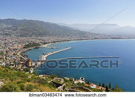 Picture - "Historic town centre of Alanya with the port and Kizil Kule or Red Tower, view from Castle Hill, Alanya, Turkish Riviera, Province of Antalya, Mediterranean Region, Turkey, Asia". Fotosearch