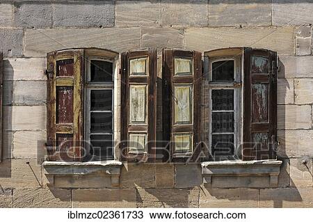"Historic windows with shutters, detailed view of a brownstone house built in the 18th century, under monumental protection, not yet restored, Bayreuther Strasse street 9, Schnaittach, Middle Franconia, Bavaria, Germany, Europe" View Large Photo Image Stock Image - "Historic windows with shutters, detailed view of a brownstone house built in the 18th century, under monumental protection, not yet restored, Bayreuther Strasse street 9, Schnaittach, Middle Franconia, Bavaria, Germany, Europe". Fotosearch