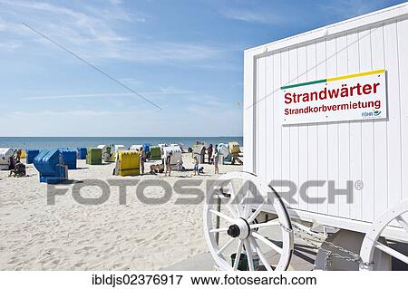 "Historical changing hut or cart with beach chairs, Wyk, Foehr island, North Frisia, Schleswig-Holstein, Germany, Europe" View Large Photo Image Stock Photo - "Historical changing hut or cart with beach chairs, Wyk, Foehr island, North Frisia, Schleswig-Holstein, Germany, Europe". Fotosearch