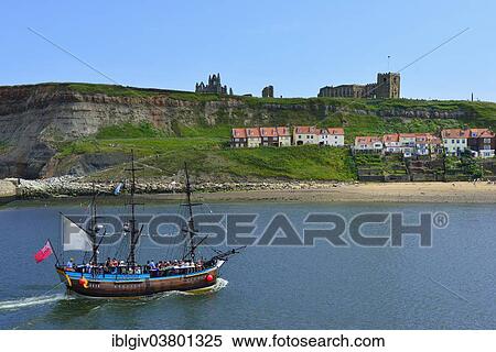 "Historical excursion boat with three masts, St. Mary's Church and Whitby Abbey at back, Whitby, North Yorkshire, England, United Kingdom, Europe" View Large Photo Image Stock Photography - "Historical excursion boat with three masts, St. Mary's Church and Whitby Abbey at back, Whitby, North Yorkshire, England, United Kingdom, Europe". Fotosearch