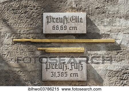 Stock Photography - "Historical measures of length at the Town Hall, gilded with explanatory panels, Bad Langensalza, Thuringia, Germany, Europe". Fotosearch