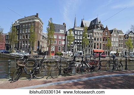 Picture - "Historical merchants' houses on the Herengracht canal in the historic centre, several old bicycles at front, Amsterdam, province of North Holland, The Netherlands, Europe". Fotosearch