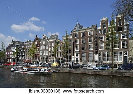 "Historical merchants' houses on the Herengracht in the historic centre, tourist boat at front, Amsterdam, province of North Holland, The Netherlands, Europe" View Large Photo Image Stock Photograph - "Historical merchants' houses on the Herengracht in the historic centre, tourist boat at front, Amsterdam, province of North Holland, The Netherlands, Europe". Fotosearch
