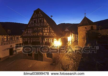 "Historical Town Hall with a fortified wall and the tower of a fortified church, Dorrenbach, German Wine Route, Rhineland-Palatinate, Germany, Europe" View Large Photo Image Stock Photo - "Historical Town Hall with a fortified wall and the tower of a fortified church, Dorrenbach, German Wine Route, Rhineland-Palatinate, Germany, Europe". Fotosearch