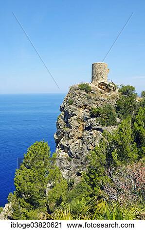 "Historical watchtower, Torre del Verger, also Torre de ses Animes, near the village of Banyalbufar, Sierra de Tramuntana, Majorca, Balearic Islands, Mediterranean, Spain, Europe" View Large Photo Image Stock Image - "Historical watchtower, Torre del Verger, also Torre de ses Animes, near the village of Banyalbufar, Sierra de Tramuntana, Majorca, Balearic Islands, Mediterranean, Spain, Europe". Fotosearch