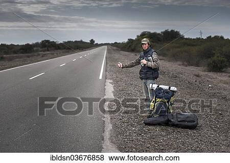 "Hitchhiker standing by the roadside, Gran Chaco, Argentina, South America" View Large Photo Image Stock Photo - "Hitchhiker standing by the roadside, Gran Chaco, Argentina, South America". Fotosearch