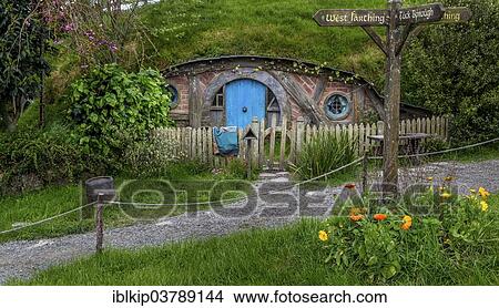 "Hobbit-hole in Hobbiton, location of the Lord of the Rings and The Hobbit film trilogy, Hinuera, Matamata, North Island, New Zealand, Oceania" View Large Photo Image Picture - "Hobbit-hole in Hobbiton, location of the Lord of the Rings and The Hobbit film trilogy, Hinuera, Matamata, North Island, New Zealand, Oceania". Fotosearch