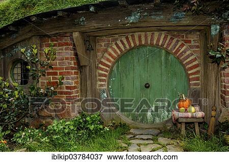 "Hobbit-hole in Hobbiton, location of the Lord of the Rings and The Hobbit film trilogy, Hinuera, Matamata, North Island, New Zealand, Oceania" View Large Photo Image Stock Photo - "Hobbit-hole in Hobbiton, location of the Lord of the Rings and The Hobbit film trilogy, Hinuera, Matamata, North Island, New Zealand, Oceania". Fotosearch
