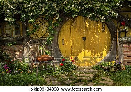 Stock Photo - "Hobbit-hole in Hobbiton, location of the Lord of the Rings and The Hobbit film trilogy, Hinuera, Matamata, North Island, New Zealand, Oceania". Fotosearch