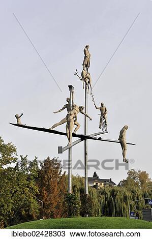 Stock Image - "Hoelderlin im Kreisverkehr sculpture by Peter Lenk, Hoelderlin art, Lauffen am Neckar, Baden-Wuerttemberg, Germany, Europe". Fotosearch