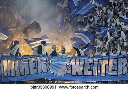 "Hoffenheim fans igniting flares, Bundesliga Relegation 2013, 1. FC Kaiserslautern - TSG 1899 Hoffenheim at Fritz-Walter-Stadion stadium, Kaiserslautern, Rhineland-Palatinate, Germany, Europe" View Large Photo Image Stock Image - "Hoffenheim fans igniting flares, Bundesliga Relegation 2013, 1. FC Kaiserslautern - TSG 1899 Hoffenheim at Fritz-Walter-Stadion stadium, Kaiserslautern, Rhineland-Palatinate, Germany, Europe". Fotosearch