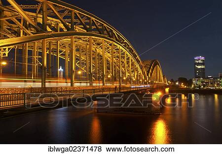 "Hohenzollern Bridge at night, Cologne Triangle tower at back, Rhine, Cologne, Rhineland, North Rhine-Westphalia, Germany, Europe" View Large Photo Image Stock Photo - "Hohenzollern Bridge at night, Cologne Triangle tower at back, Rhine, Cologne, Rhineland, North Rhine-Westphalia, Germany, Europe". Fotosearch