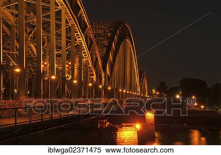 Stock Photography - "Hohenzollern Bridge at night, Rhine, Cologne, Rhineland, North Rhine-Westphalia, Germany, Europe". Fotosearch