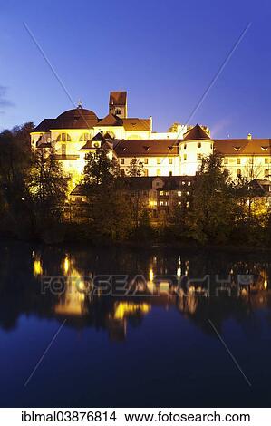 Picture - "Hohes Schloss castle reflected in river Lech, Fussen, Ostallgau, Allgau, Upper Bavaria, Bavaria, Germany, Europe". Fotosearch