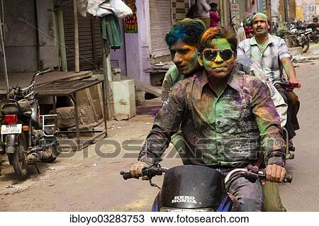 Stock Image - "Holi Festival, when Indus celebrate the beginning of Spring, by throwing coloured water and gulal (powder) at anyone within range, Bundi, Rajasthan, India, Asia". Fotosearch
