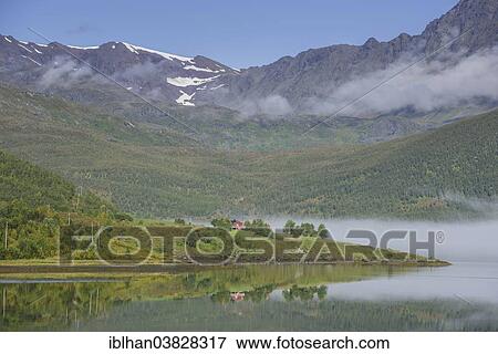 "Holiday cottage and mountains in Lakselvbukta Bay, Troms, Norway, Europe" View Large Photo Image Stock Photo - "Holiday cottage and mountains in Lakselvbukta Bay, Troms, Norway, Europe". Fotosearch