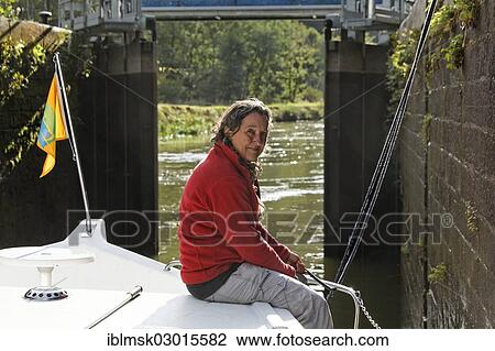 "Holidaymaker in a lock chamber while passing through a downward lock, houseboat on the Canal des Vosges, formerly Canal de l'Est, Lock 33 at La Pipee, PK 124, Fontenoy-le-Chateau, Epinal, Lorraine, Departement Vosges, France, Europe" View Large Photo Image Stock Image - "Holidaymaker in a lock chamber while passing through a downward lock, houseboat on the Canal des Vosges, formerly Canal de l'Est, Lock 33 at La Pipee, PK 124, Fontenoy-le-Chateau, Epinal, Lorraine, Departement Vosges, France, Europe". Fotosearch