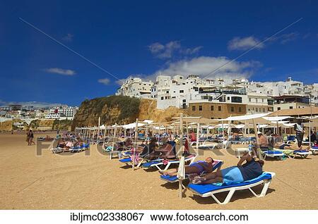 "Holidaymakers on the beach, Albufeira, Praia Dos Pescadores, Algarve, Portugal, Europe" View Large Photo Image Stock Photo - "Holidaymakers on the beach, Albufeira, Praia Dos Pescadores, Algarve, Portugal, Europe". Fotosearch