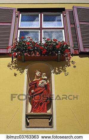 "Holy figure, """"Mary with the baby Jesus"""", in a niche in a former patrician house, Dinkelsbuhl, Middle Franconia, Bavaria, Germany, Europe" View Large Photo Image Stock Image - "Holy figure, """"Mary with the baby Jesus"""", in a niche in a former patrician house, Dinkelsbuhl, Middle Franconia, Bavaria, Germany, Europe". Fotosearch