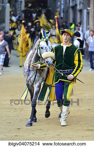 "Horse and horse leader of the Contrada of the Caterpillar, Nobile Contrada del Bruco, at the parade before the historical horse race Palio di Siena, Piazza del Campo, Siena, Tuscany, Italy, Europe" View Large Photo Image Picture - "Horse and horse leader of the Contrada of the Caterpillar, Nobile Contrada del Bruco, at the parade before the historical horse race Palio di Siena, Piazza del Campo, Siena, Tuscany, Italy, Europe". Fotosearch