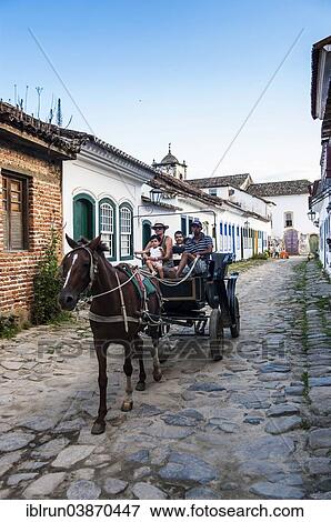 "Horse cart with tourists, Paraty, Rio de Janeiro State, Brazil, South America" View Large Photo Image Stock Photo - "Horse cart with tourists, Paraty, Rio de Janeiro State, Brazil, South America". Fotosearch