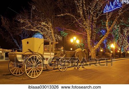 Stock Photograph - "Horse drawn carriage and Christmas decorations in Odessa at night, Odessa, Odessa Oblast, Ukraine, Europe". Fotosearch