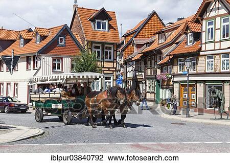 "Horse-drawn carriage, """"Kleinstes Haus"""", German for """"Smallest House"""" right, Kochstrasse, Wernigerode, Saxony-Anhalt, Germany, Europe" View Large Photo Image Stock Image - "Horse-drawn carriage, """"Kleinstes Haus"""", German for """"Smallest House"""" right, Kochstrasse, Wernigerode, Saxony-Anhalt, Germany, Europe". Fotosearch