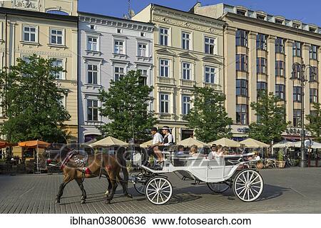 "Horse-drawn carriage on the Rynek Glowny main square, Stare Miasto old town, Krakow, Lesser Poland Voivodeship, Poland, Europe" View Large Photo Image Stock Photograph - "Horse-drawn carriage on the Rynek Glowny main square, Stare Miasto old town, Krakow, Lesser Poland Voivodeship, Poland, Europe". Fotosearch