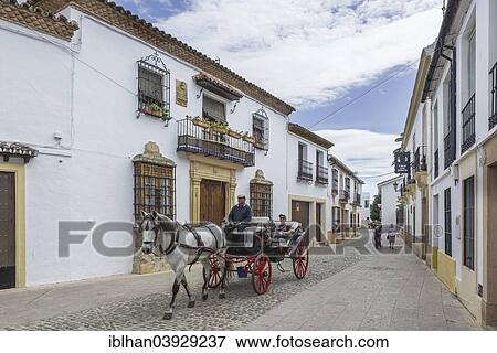 "Horse-drawn carriage with tourists in the historic centre, Ronda, Malaga province, Andalucia, Spain, Europe" View Large Photo Image Stock Photo - "Horse-drawn carriage with tourists in the historic centre, Ronda, Malaga province, Andalucia, Spain, Europe". Fotosearch