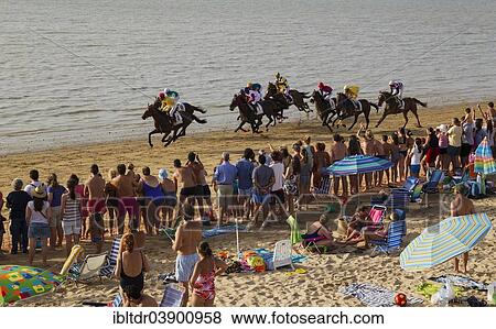 Stock Photo - "Horse race at the beach of Sanlucar de Barrameda at the Guadalquivir river mouth, Cadiz province, Andalusia, Spain, Europe". Fotosearch