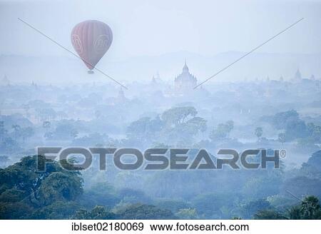 "Hot air balloon at dawn over the landscape of pagodas in Bagan, Myanmar, Burma, Southeast Asia, Asia" View Large Photo Image Stock Photo - "Hot air balloon at dawn over the landscape of pagodas in Bagan, Myanmar, Burma, Southeast Asia, Asia". Fotosearch