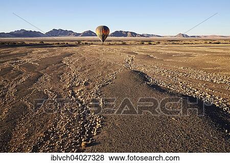 "Hot air balloon, behind the Naukluft Mountains, Namib-Naukluft National Park, Namib Desert, Namibia, Africa" View Large Photo Image Stock Photo - "Hot air balloon, behind the Naukluft Mountains, Namib-Naukluft National Park, Namib Desert, Namibia, Africa". Fotosearch