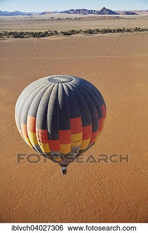 "Hot air balloon, behind the Naukluft Mountains, Namib-Naukluft National Park, Namib Desert, Namibia, Africa" View Large Photo Image Stock Photograph - "Hot air balloon, behind the Naukluft Mountains, Namib-Naukluft National Park, Namib Desert, Namibia, Africa". Fotosearch