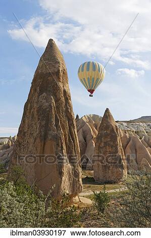"Hot air balloon, Fairy Chimneys, tufa formations, Goreme National Park, Cappadocia, Central Anatolia Region, Anatolia, Turkey, Asia" View Large Photo Image Stock Photo - "Hot air balloon, Fairy Chimneys, tufa formations, Goreme National Park, Cappadocia, Central Anatolia Region, Anatolia, Turkey, Asia". Fotosearch